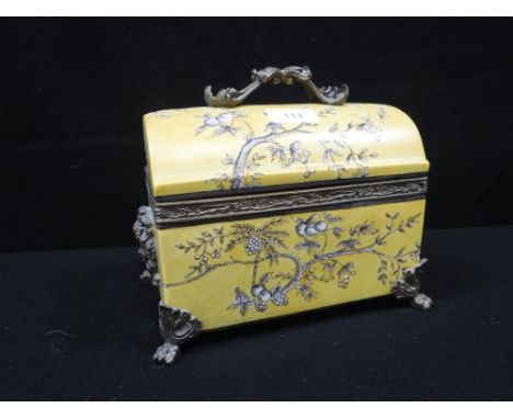 A YELLOW CERAMIC LIDDED BOX with ormolu mounts and handle 9" wide
