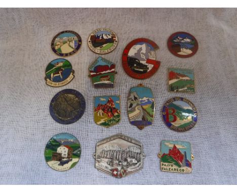 A QUANTITY OF ENAMEL DOLOMITE MOUNTAIN PASS BADGES including Passo Rolle and others
