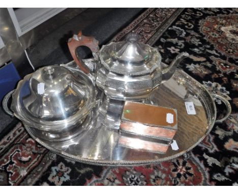 AN OVAL PLATED TWO-HANDLED TEA TRAY, teapot and other items
