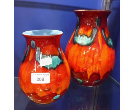 TWO POOLE POTTERY VASES with variegated orange and turquoise glazes