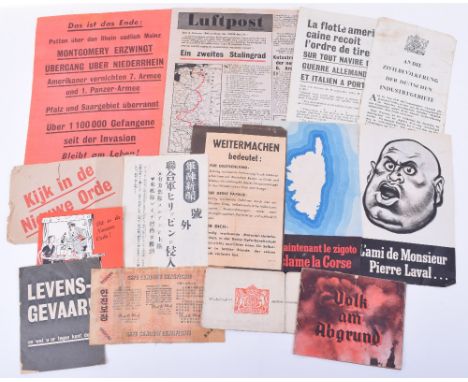 14x WW2 Propaganda & Safe Conduct Passes, including an interesting fold our booklet which shows Hitler serving a women and ch