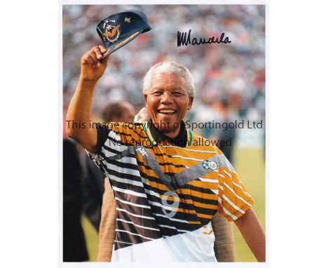 NELSON MANDELA    Signed Colour photograph of Nelson Mandela in a South Africa football shirt. Measures circa 8" x 10". Authe