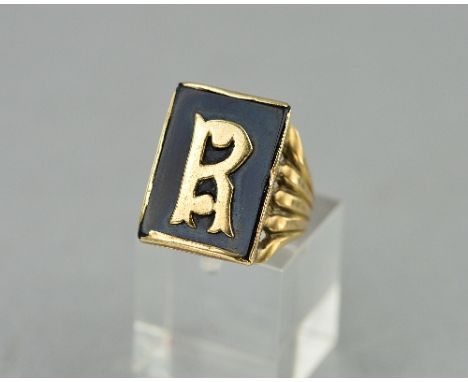 A 9CT GOLD AND BLACK ENAMEL SIGNET RING, with the letter R, ring size H, approximate weight 6.1 grams