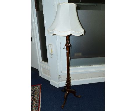 A LATE VICTORIAN MAHOGANY STANDARD LAMP, on tripod legs with claw feet and a shade