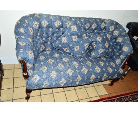 A VICTORIAN MAHOGANY FRAMED BUTTONBACK SOFA, with blue upholstery and two cushions, approximate width 145cm