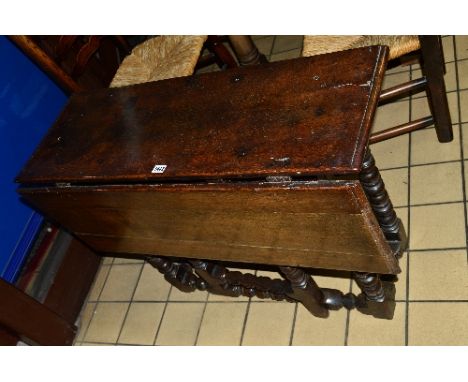 AN EARLY 18TH CENTURY OAK RECTANGULAR SINGLE DROP GATE LEG TABLE, moulded edge, on six bobbin and cotton reel turned legs and