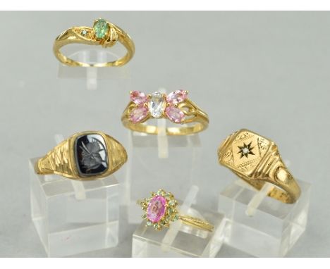 FIVE 9CT GOLD DRESS RINGS, to include a hematite signet ring, ring size V 1/2, a diamond signet ring, ring size V, a green ge