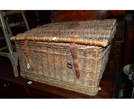 A VINTAGE WICKER TRUNK