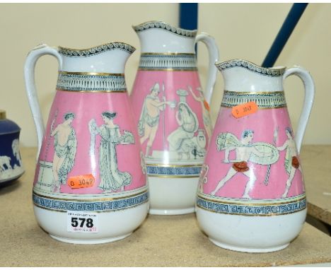 THREE CERAMIC PRATTWARE STYLE GRADUATING JUGS DECORATED WITH GRECIAN SCENES, some restoration to one jug, tallest approximate