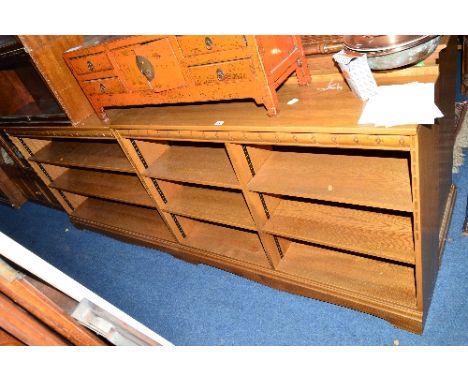 TWO SIMILAR ERCOL STYLE ASH OPEN BOOKCASES, with adjustable shelves, approximate maximum size width 122cm x depth 31cm x heig