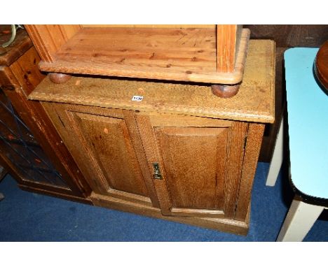 A LIGHT OAK VINTAGE SMALL TWO DOOR CUPBOARD