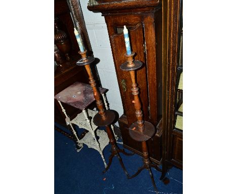 A PAIR OF VICTORIAN WALNUT CANDLE STANDS, with central shelf (sd)