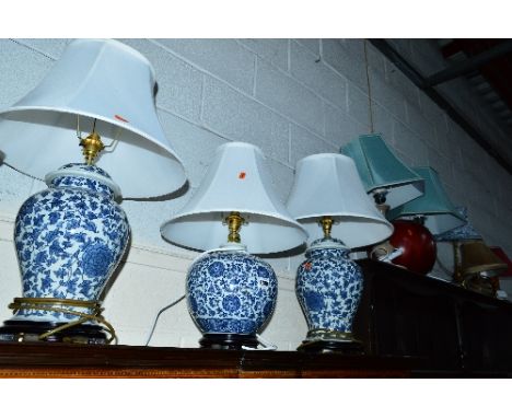 A PAIR OF CONTINENTAL STYLE CERAMIC TABLE LAMPS, with shades, a similar table lamp, five various other table lamps and a vase