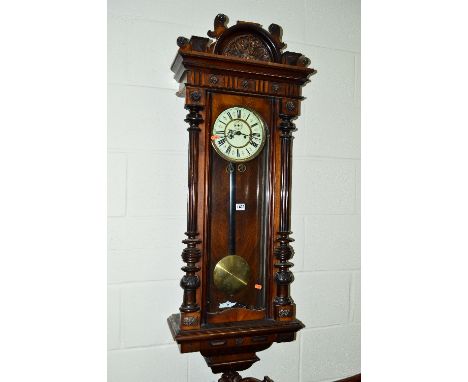 A VICTORIAN WALNUT REGULATOR WALL CLOCK, 8 day movement, the circular enamel dial with Roman numerals (two weights and one wi