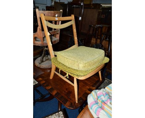 A BLONDE ERCOL 1960'S CHAIR, on front cylindrical tapering front legs (distressed)