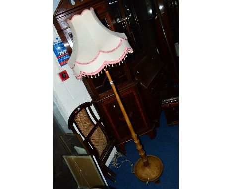 AN ART DECO WALNUT STANDARD LAMP, with a shade