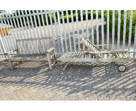 A WOODEN GARDEN BENCH, approximate length 157cm and a wooden sun lounger (all proceeds to Local Lichfield Charities) (2)