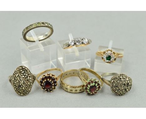 A COLLECTION OF RINGS, to include two 9ct garnet cluster rings, ring size J 1/2 and ring size L, a 9ct gold green and white p