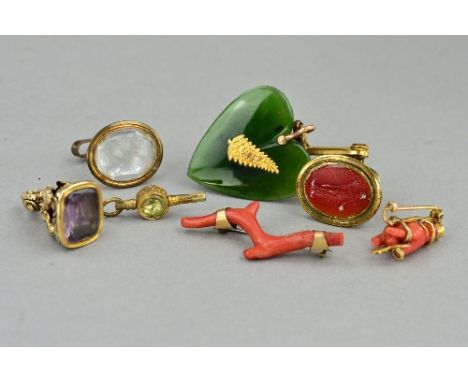 A MIXED JEWELLERY LOT, to include a mid Victorian coral hand brooch (a/f), approximate weight 3.9 grams, two carved intaglio 