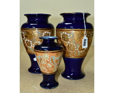 A PAIR OF DOULTON LAMBETH SLATERS PATENT BALUSTER SHAPED VASES, with a central band of gilt and enamel decoration with a deep