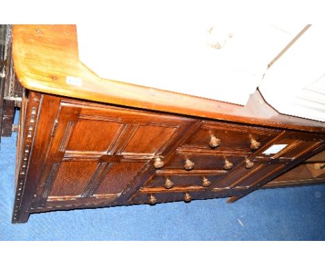 A DARK ERCOL ASH SIDEBOARD, with four central drawers, approximate size width 144cm x depth 50cm x height 90cm