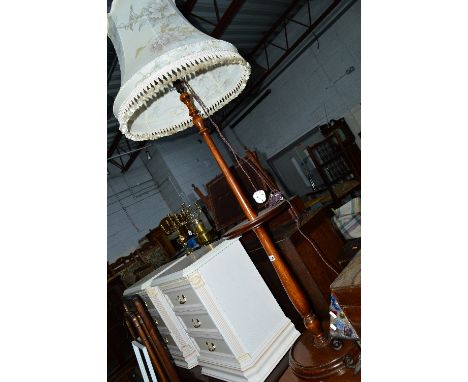A STAINED OAK STANDARD LAMP, with central circular shelf and shade