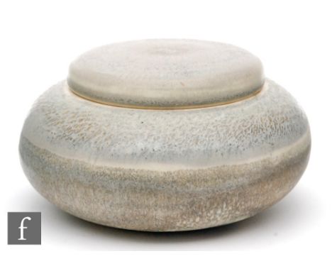 Chris Carter - A later 20th Century studio pottery tea caddy of compressed form decorated with faint incised lines and glazed