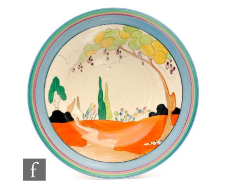Clarice Cliff - Tulips - A 13in charger circa 1933, hand painted with a stylised cottage garden scene with tree with tonal bl