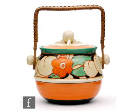Clarice Cliff - Floreat - A shape 335 biscuit barrel circa 1930, hand painted with stylised flowers and foliage between orang
