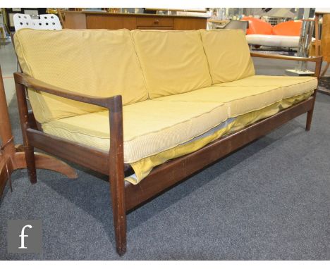 In the manner of Toothill for Heals - A teak framed three-seat sofa or settee, with an open frame, height of back 68cm, width