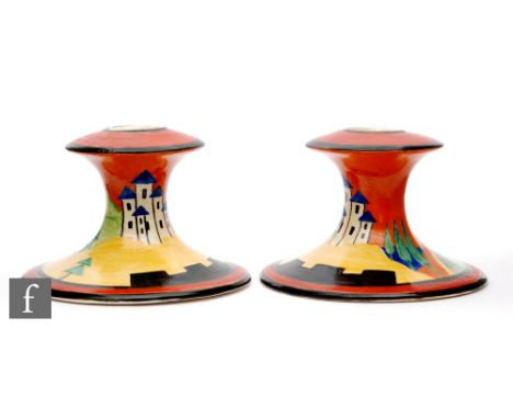 Clarice Cliff -Applique Lucerne - A pair of shape 310 candle sticks circa 1929, hand painted with an extensive landscape with