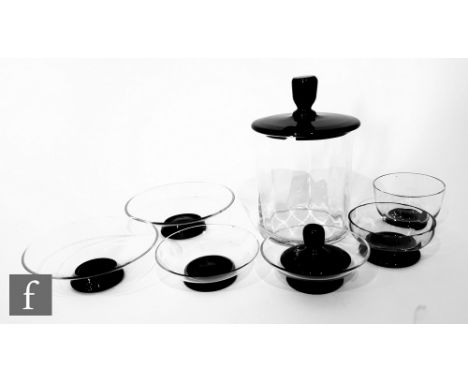Simon Gate - Orrefors - A collection of 1930s glass dishes, all clear with an applied black foot, diameter of largest 8.5cm, 
