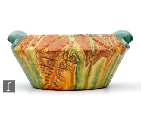 Clarice Cliff - Inspiration - An Ibiris shape bowl of angular form with relief moulded abstract leaf forms and scroll handles