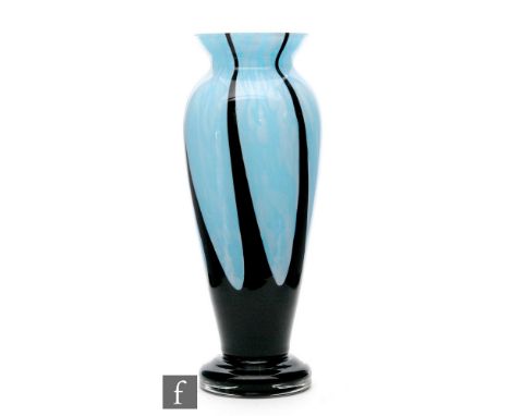 Unknown - A Czechoslovakian glass vase of footed ovoid form with flared rim, the mottled pale blue ground with deep amethyst 
