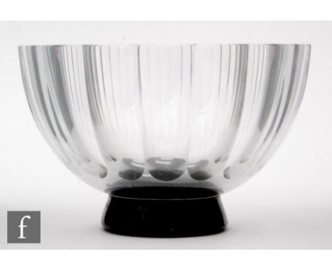 Simon Gate - Orrefors - A 1930s crystal glass bowl designed by Simon Gate, facet cut and polished and raised on a black foot,