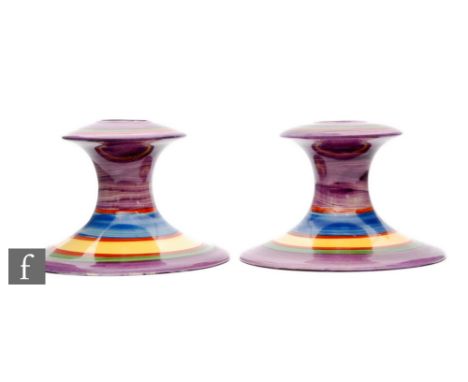 Clarice Cliff - Liberty Stripe - A pair of shape 310 candlesticks circa 1928 with graduated bands of alternating colour, hand