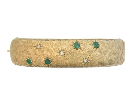 A 9ct gold emerald and diamond hinged bangle by Cropp &amp; Farr, A 9ct gold emerald and diamond hinged bangle by Cropp &amp;