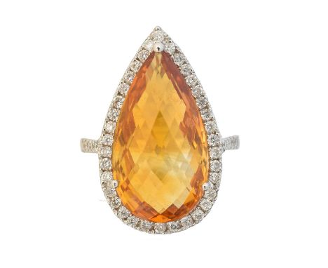 A citrine and diamond cluster ring, A citrine and diamond cluster ring, the briolette pear cut citrine with brilliant cut dia