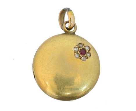 An early 20th century ruby and diamond hinged locket,  An early 20th century ruby and diamond hinged locket, of circular form