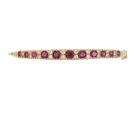A ruby and diamond hinged bangle, A 9ct gold ruby and diamond hinged bangle, the circular shape ruby line with brilliant cut 
