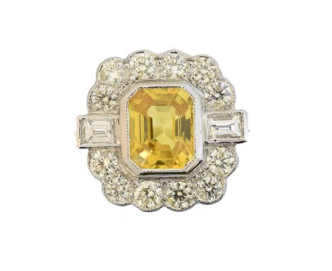 A sapphire and diamond cluster ring, A sapphire and diamond cluster ring, the rectangular shape yellow sapphire within a bril