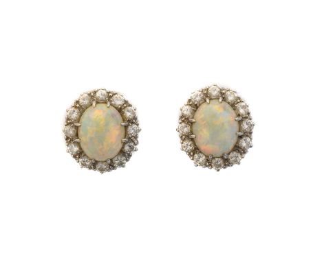 A pair of opal and diamond earrings, A pair of opal and diamond earrings, each designed as an oval opal cabochon within a bri