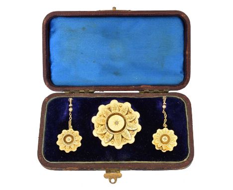 A suite of Victorian jewellery,  A suite of late Victorian jewellery, comprising a brooch and pair of earrings, each designed