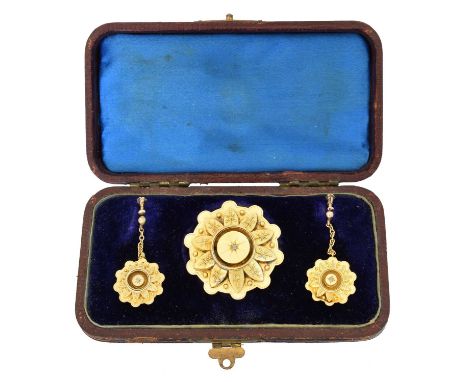 A suite of Victorian jewellery,  A suite of late Victorian jewellery, comprising a brooch and pair of earrings, each designed