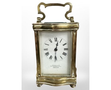 An early twentieth century brass carriage clock by Stewart and Co with key.