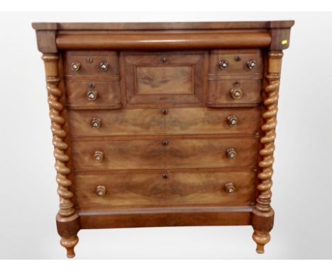 A Victorian mahogany Scotch chest with barley twist column supports, fitted five drawers around a central hat drawer, width 1