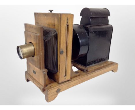An early 20th century oak plate camera, with retailer's plaque for Doughty's Photographic Dealers, 4B Savile Street, Hull, to