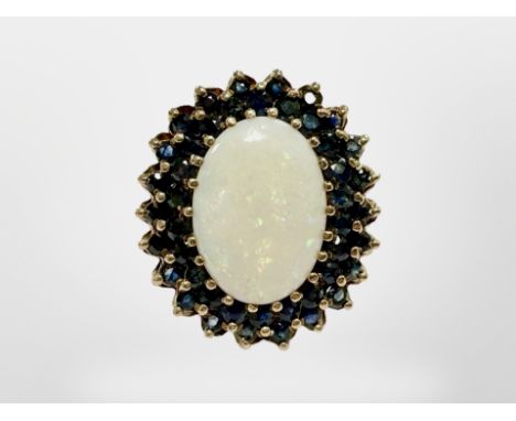 A good quality yellow gold opal and sapphire ring