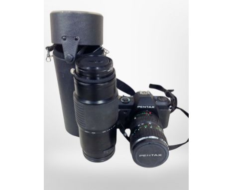 A Pentax P30N camera body with 28-80mm lens, Sigma 75-300mm zoom lens 