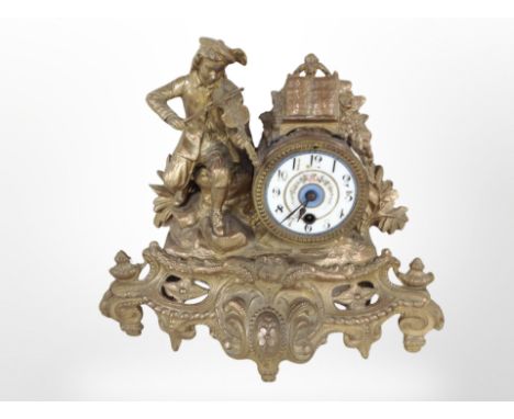 A gilt metal figural mantel clock with enamel dial, height 29cm.